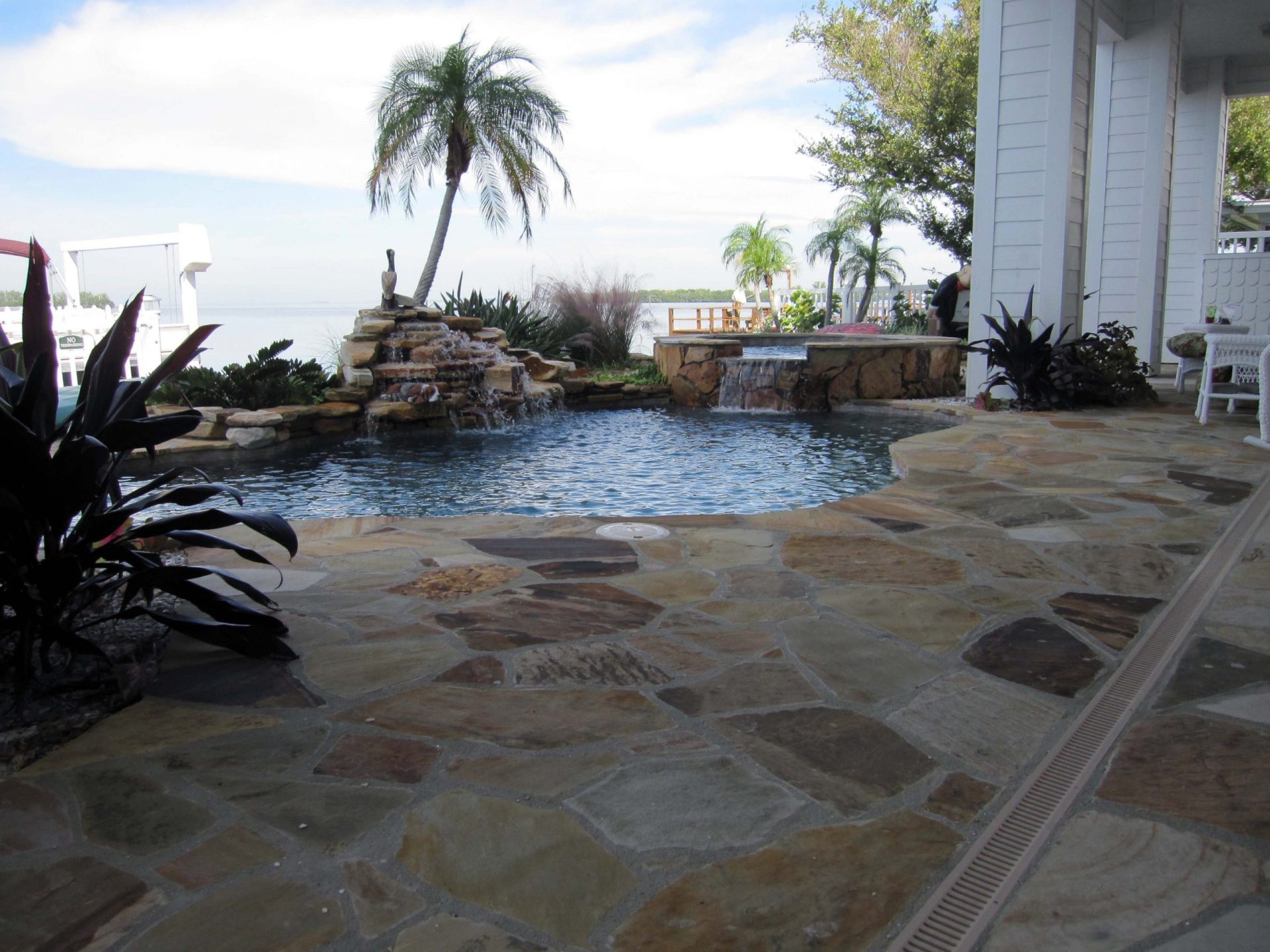 Custom Flagstone Patio and Pool Deck by Waterscapes Inc.