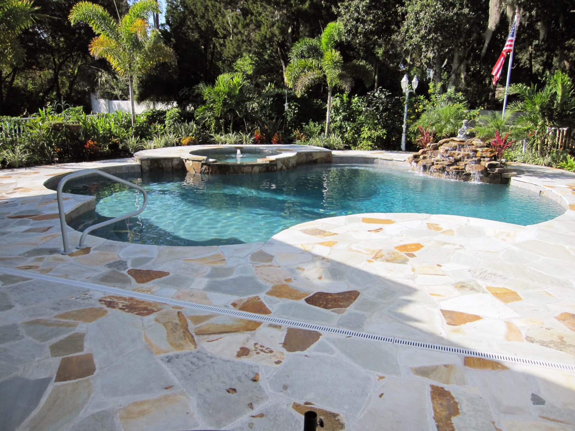 Custom Flagstone Patio and Pool Deck by Waterscapes Inc.