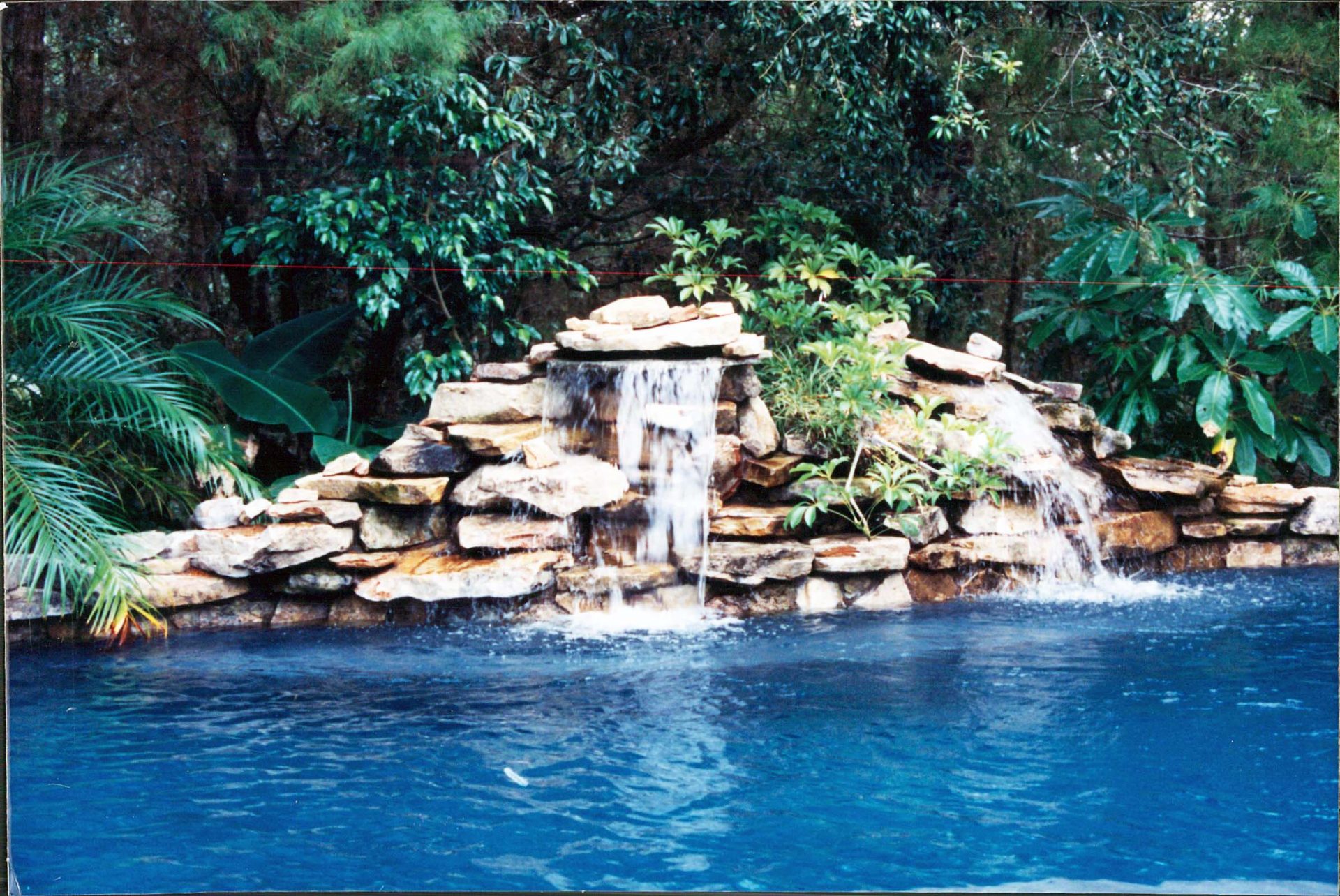 Custom Pool Waterfall by Waterscapes Inc.